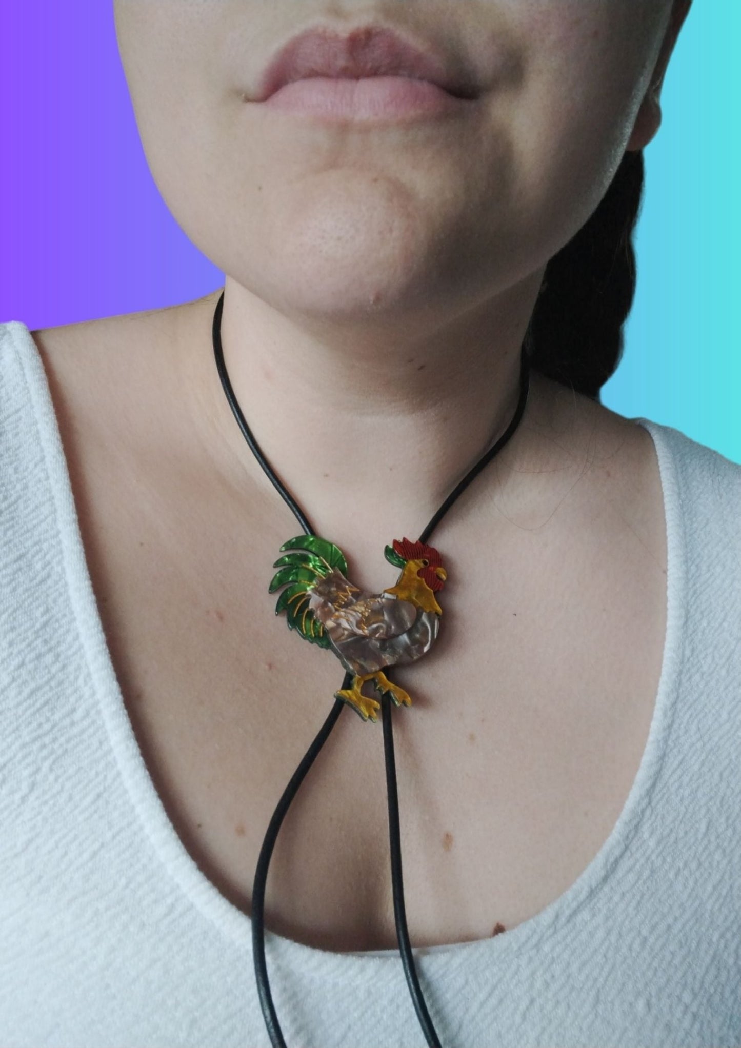 Handcrafted Rooster Bolo Tie made from High-Quality Acrylic and Leather by Lindsay O'Donnell - Closeup - on model