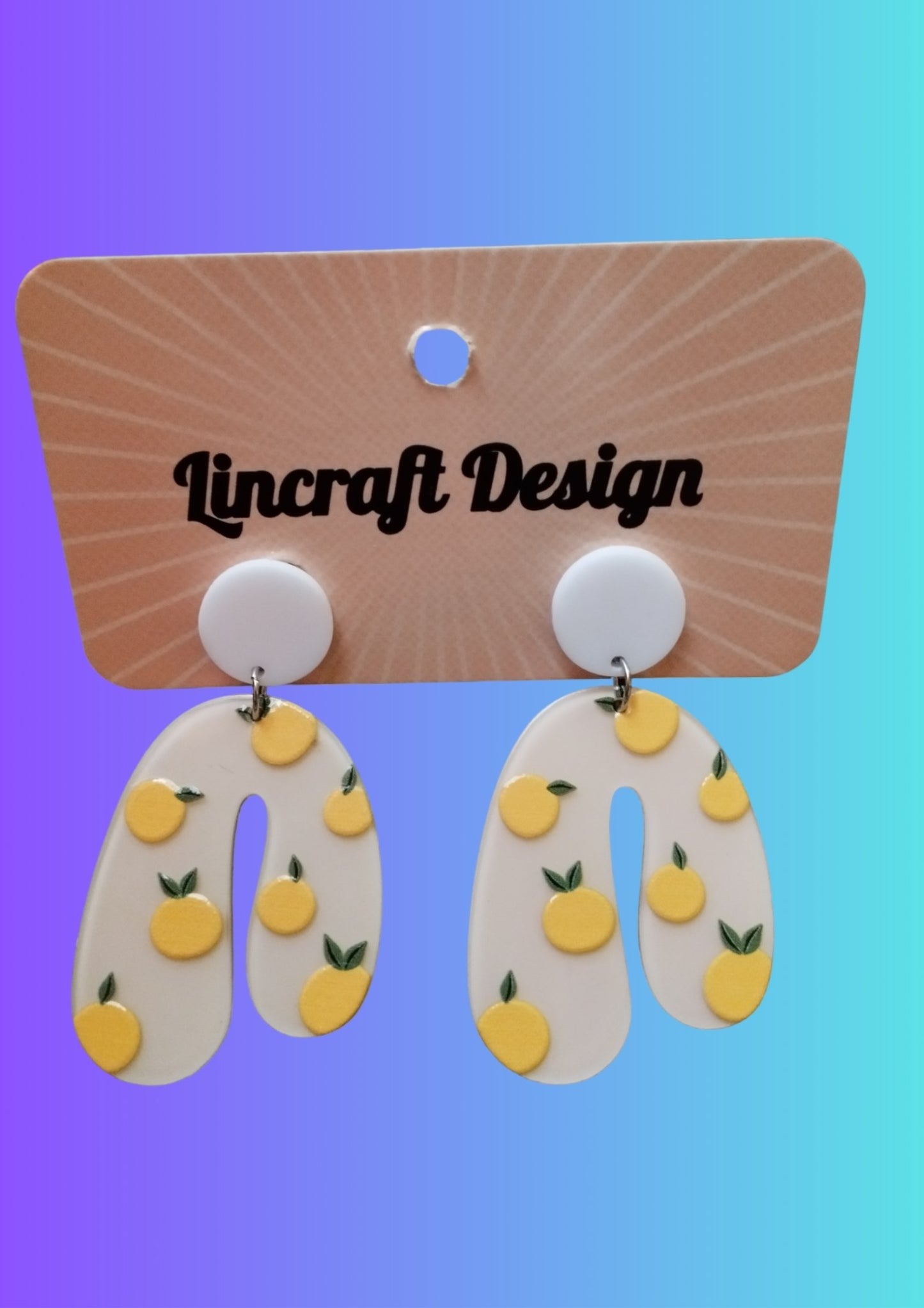 Handmade Acrylic cream peach dangle drip Earrings by Lindsay O'Donnell.